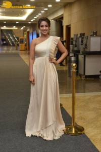 Nivetha Pethuraj in a shoulderless dress posing for photos