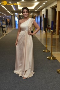 Nivetha Pethuraj in a shoulderless dress posing for photos