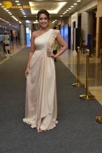 Nivetha Pethuraj in a shoulderless dress posing for photos