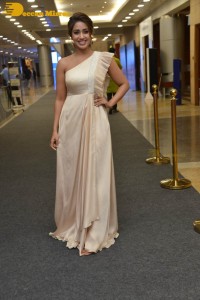 Nivetha Pethuraj in a shoulderless dress posing for photos