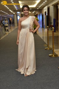 Nivetha Pethuraj in a shoulderless dress posing for photos