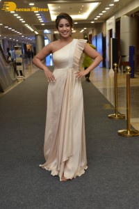 Nivetha Pethuraj in a shoulderless dress posing for photos