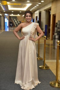 Nivetha Pethuraj in a shoulderless dress posing for photos