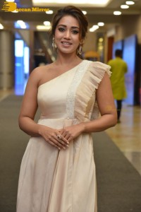 Nivetha Pethuraj in a shoulderless dress posing for photos