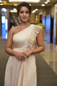 Nivetha Pethuraj in a shoulderless dress posing for photos