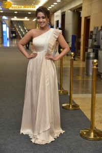 Nivetha Pethuraj in a shoulderless dress posing for photos