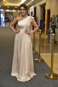 Nivetha Pethuraj in a shoulderless dress posing for photos