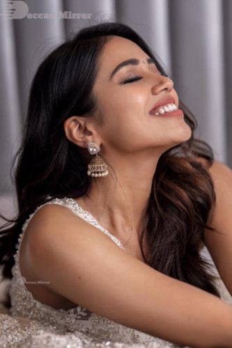 Tamil and Telugu Actress Nivetha Pethuraj is seen in a white dress in this photoshoot