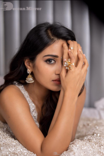 Tamil and Telugu Actress Nivetha Pethuraj is seen in a white dress in this photoshoot