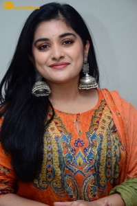 Actress Nivetha Thomas in a orange salwar dress