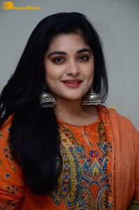 Actress Nivetha Thomas in a orange salwar dress
