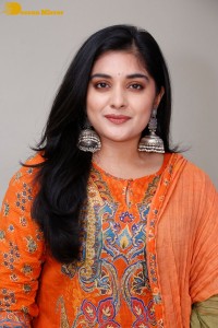 Actress Nivetha Thomas in a orange salwar dress