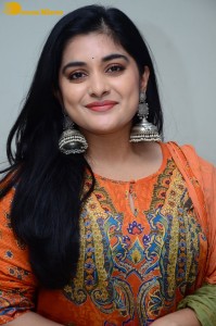 Actress Nivetha Thomas in a orange salwar dress