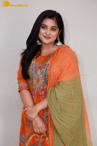Actress Nivetha Thomas in a orange salwar dress
