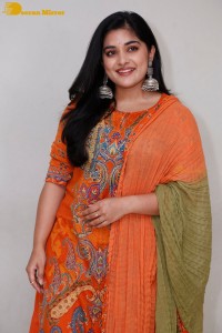 Actress Nivetha Thomas in a orange salwar dress