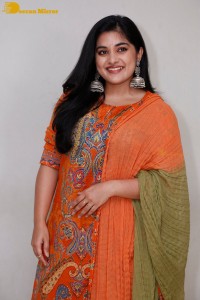 Actress Nivetha Thomas in a orange salwar dress