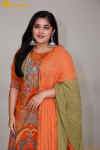 Actress Nivetha Thomas in a orange salwar dress