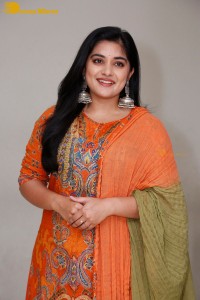 Actress Nivetha Thomas in a orange salwar dress