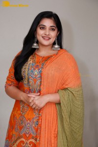 Actress Nivetha Thomas in a orange salwar dress
