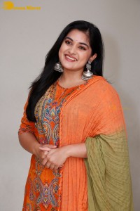 Actress Nivetha Thomas in a orange salwar dress