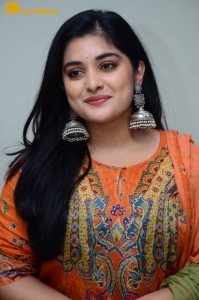 Actress Nivetha Thomas in a orange salwar dress
