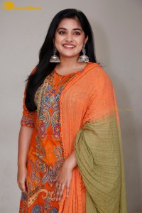 Actress Nivetha Thomas in a orange salwar dress