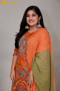 Actress Nivetha Thomas in a orange salwar dress