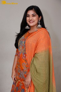 Actress Nivetha Thomas in a orange salwar dress