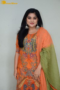 Actress Nivetha Thomas in a orange salwar dress