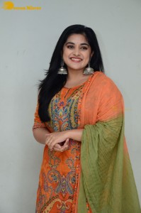 Actress Nivetha Thomas in a orange salwar dress