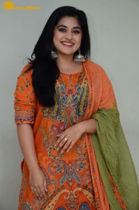 Actress Nivetha Thomas in a orange salwar dress