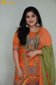 Actress Nivetha Thomas in a orange salwar dress