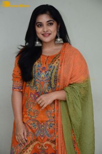 Actress Nivetha Thomas in a orange salwar dress