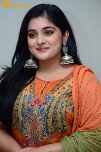 Actress Nivetha Thomas in a orange salwar dress
