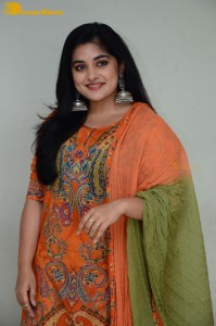 Actress Nivetha Thomas in a orange salwar dress