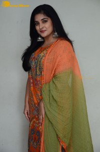 Actress Nivetha Thomas in a orange salwar dress