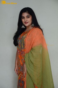 Actress Nivetha Thomas in a orange salwar dress
