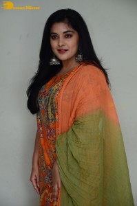 Actress Nivetha Thomas in a orange salwar dress