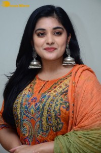 Actress Nivetha Thomas in a orange salwar dress