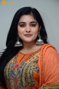 Actress Nivetha Thomas in a orange salwar dress