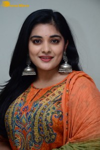 Actress Nivetha Thomas in a orange salwar dress