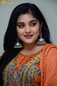 Actress Nivetha Thomas in a orange salwar dress