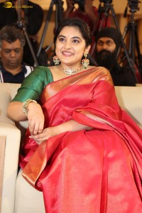 actress Nivetha Thomas gorgeous in a red saree at a movie event