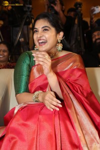 actress Nivetha Thomas gorgeous in a red saree at a movie event