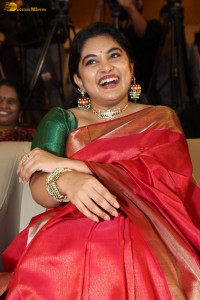 actress Nivetha Thomas gorgeous in a red saree at a movie event