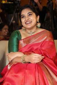 actress Nivetha Thomas gorgeous in a red saree at a movie event