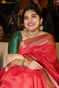 actress Nivetha Thomas gorgeous in a red saree at a movie event