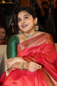 actress Nivetha Thomas gorgeous in a red saree at a movie event
