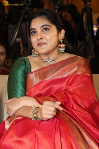 actress Nivetha Thomas gorgeous in a red saree at a movie event