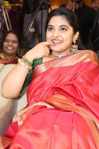 actress Nivetha Thomas gorgeous in a red saree at a movie event